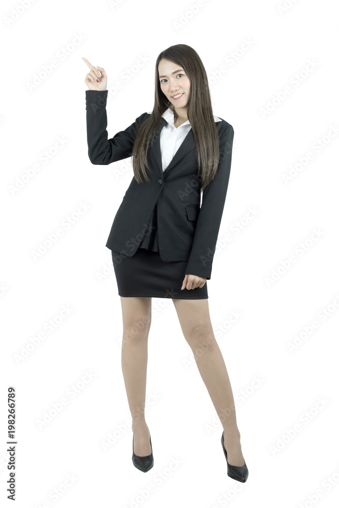 Smiling Asian business woman pointing and presenting, full length portrait isolated on white background. Smiling Asian business woman pointing and presenting, full length portrait isolated on white background.