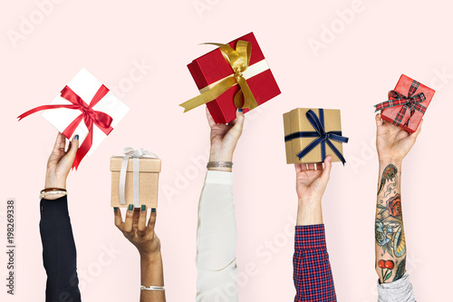 Diversity hands holding gifts photo
