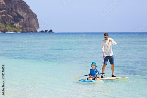 family stand up paddleboarding