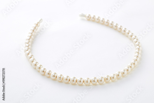 pearl hair band on white background