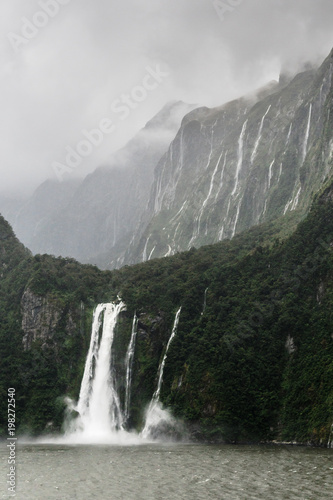 Stirling Falls in Milford Sound  New Zealand  with mountains in background