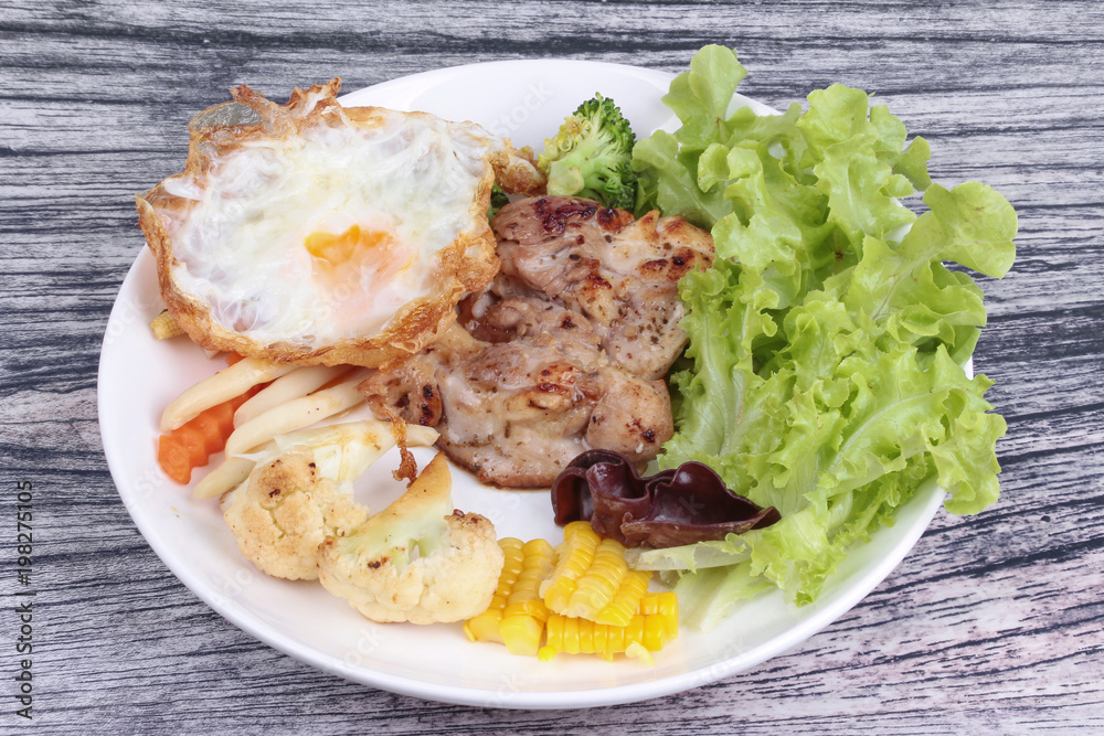 Chicken steak and grilled mixed vegetables . Chicken steak and grilled mixed vegetables .