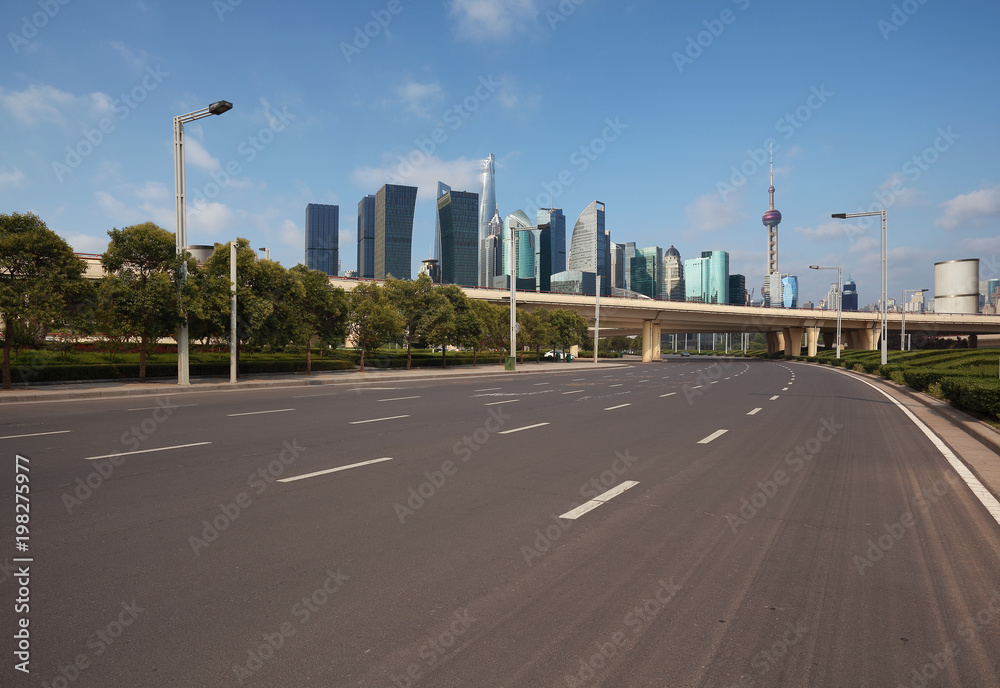 Empty road surface floor with city landmark buildings of Shanghai Skyline