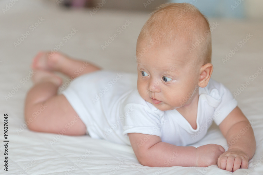 Bright portrait of a sweet little 4 months old newborn baby boy

