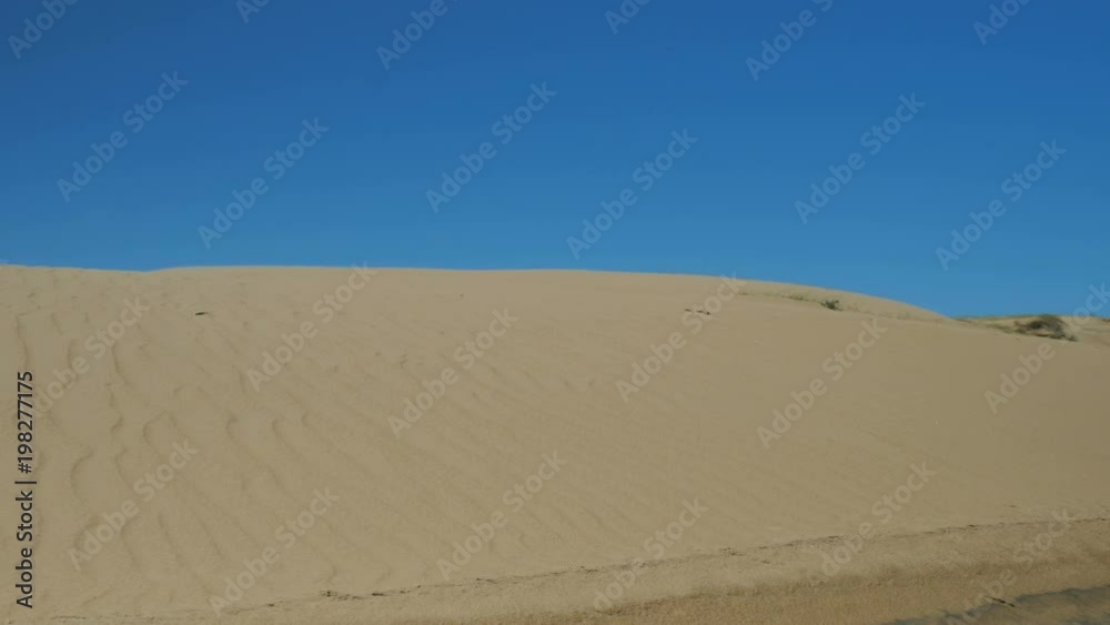 Sand dunes under blue sky in Cabo Polonio national park in Uruguay. Sand dunes under blue sky in Cabo Polonio national park in Uruguay.