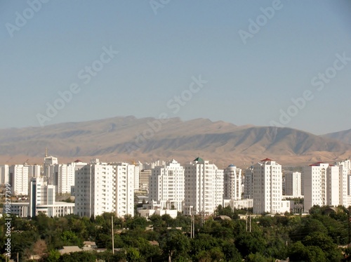 Aerial view of high-rise office buildings residential and Kopet Dag mountain range Ashgabat. Turkmenistan