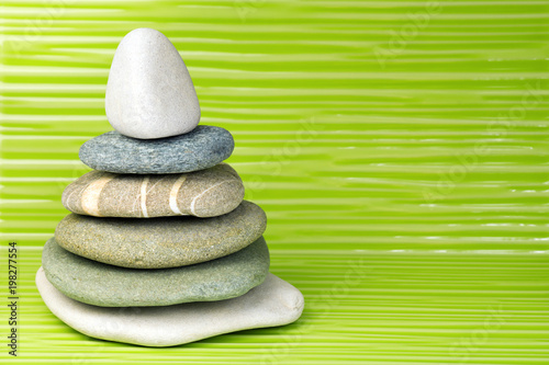 Photography Multicolored zen stones on a wavy surface
