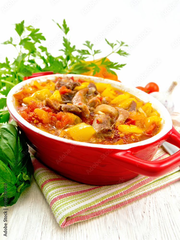 Ragout of meat and vegetables in brazier on towel Ragout of meat and vegetables in brazier on towel