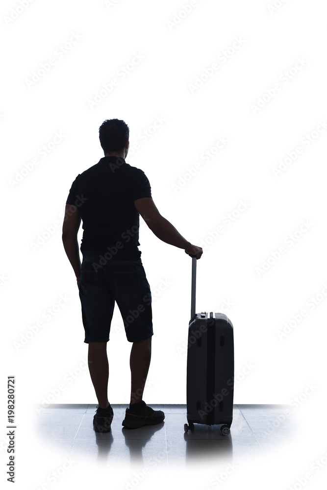 silhouette of a traveler with is luggage isolated on white background . airport silhouette of a traveler with is luggage isolated on white background . airport
