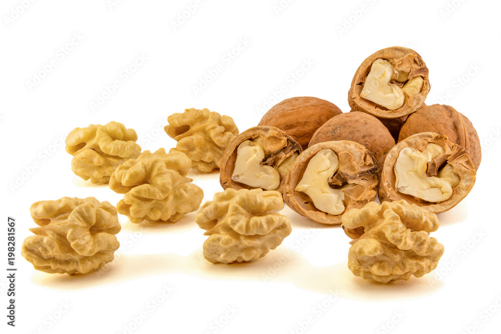 walnut macro isolate on a white background. Peeled nuts and shell close-up macro. walnut macro isolate on a white background. Peeled nuts and shell close-up macro.