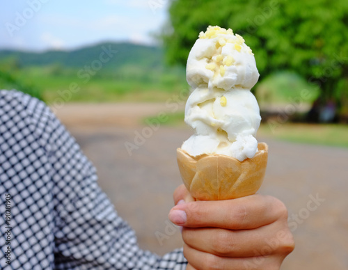 Close-up hand holding ice-cream. 