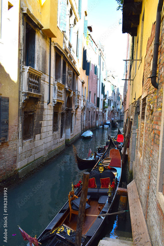 Venetian Gondolas in a side canal just off The Grand Canal, Venice