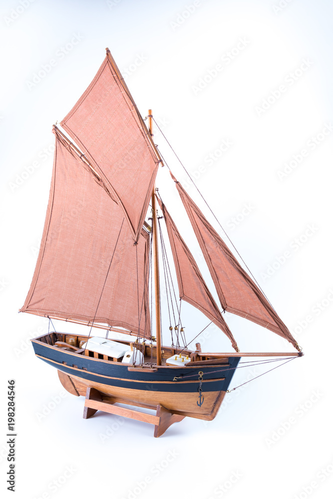 Miniature of a pirate sloop ship brown and black isolated in white background