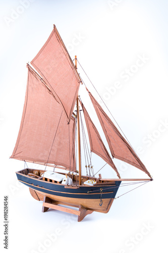 Miniature of a pirate sloop ship brown and black isolated in white background