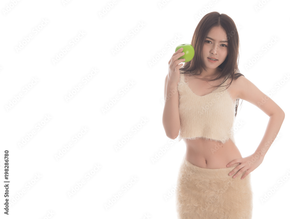 Portrait of asian woman weighting loss l with green apple isolated on white background. weight loss concepts. Free from copy space. Portrait of asian woman weighting loss l with green apple isolated on white background. weight loss concepts. Free from copy space.