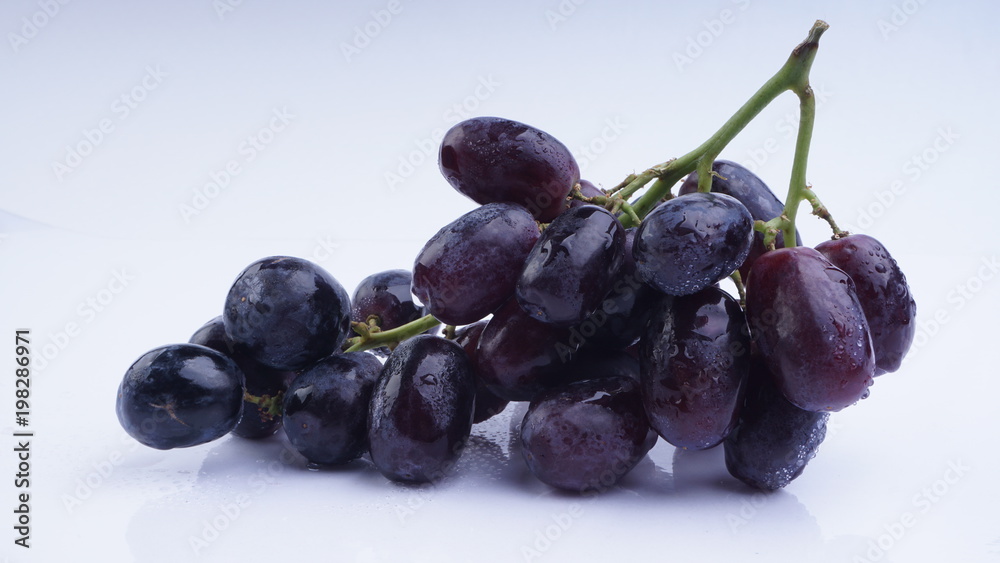 Closeup of Grapes on a white background. Selective focus and crop fragment. Closeup of Grapes on a white background. Selective focus and crop fragment.