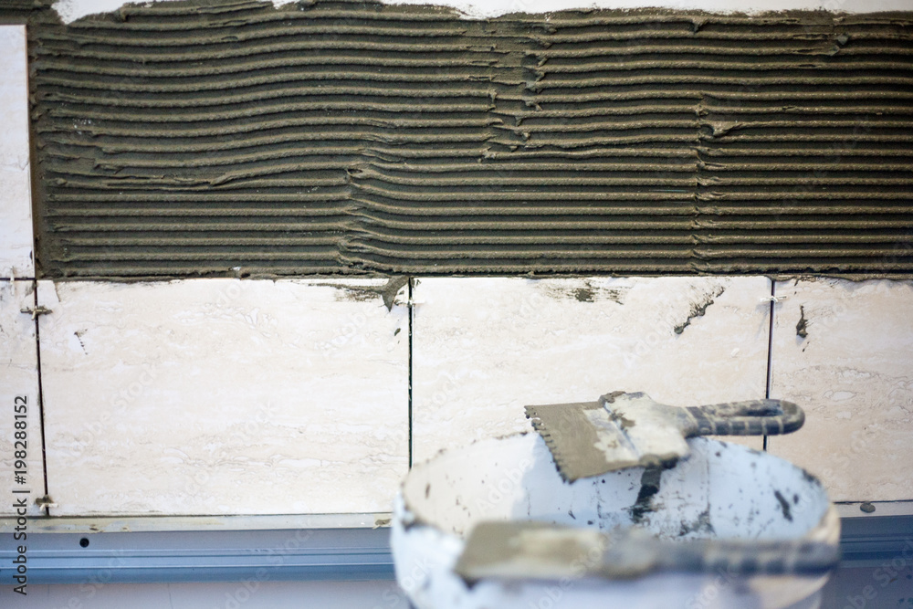 the tiler are laying the ceramic tile the tiler are laying the ceramic tile
