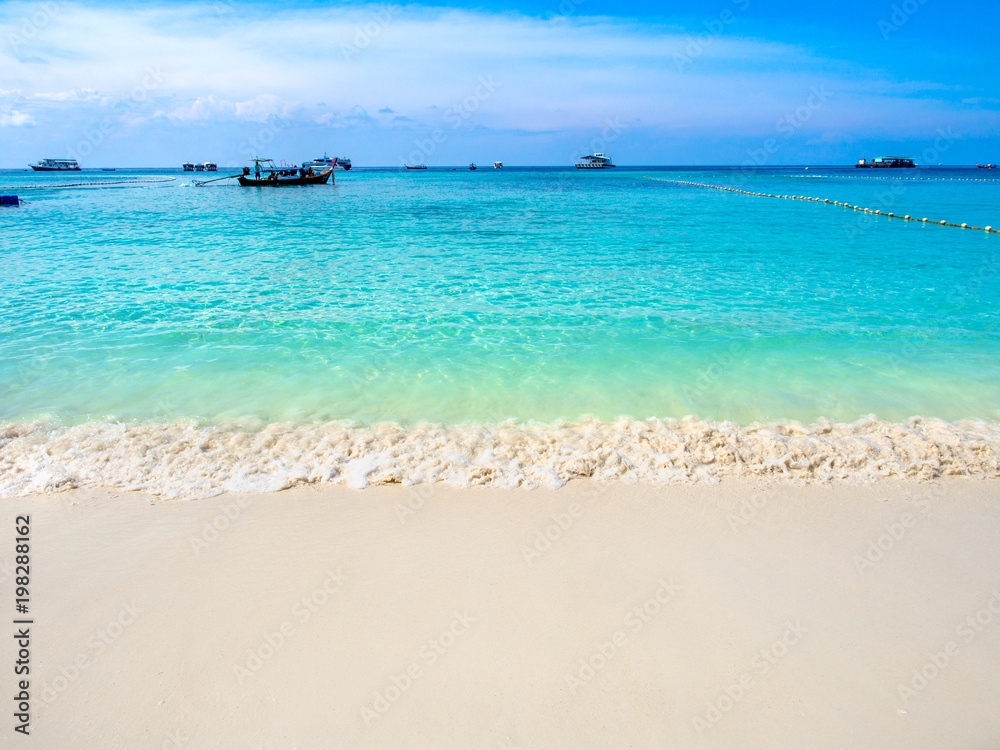 Turquoise sea and white sand beach with clear blue sky in sunny summer day at Koh Lipe island,Thailand.