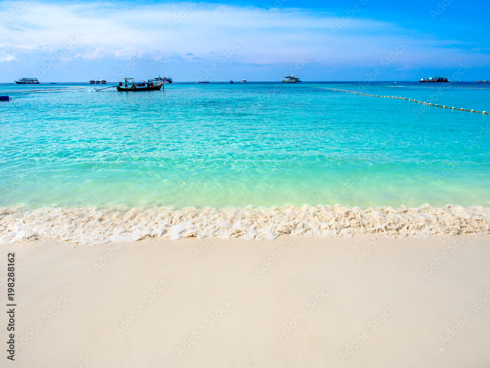 Turquoise sea and white sand beach with clear blue sky in sunny summer day at Koh Lipe island,Thailand. Turquoise sea and white sand beach with clear blue sky in sunny summer day at Koh Lipe island,Thailand.