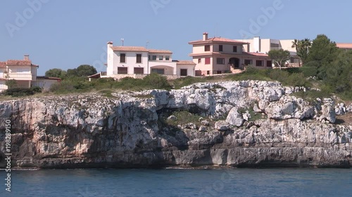 Hoilday houses at the shores of Porto Cristo, Mallorca, Spain. photo