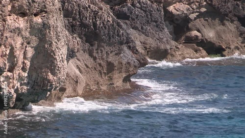 Spilling at the cliffs of Porto Cristo, Mallorca, Spain. photo