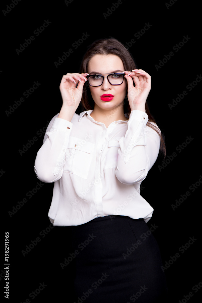 portrait of a sexy business woman in the studio on a black background portrait of a sexy business woman in the studio on a black background