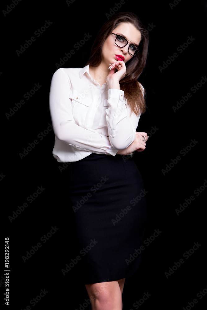 portrait of a sexy business woman in the studio on a black background portrait of a sexy business woman in the studio on a black background