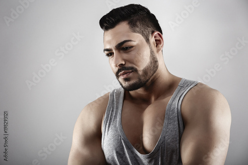 Handsome muscular man posing in studio
