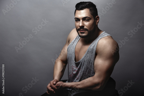 Handsome muscular man posing in studio