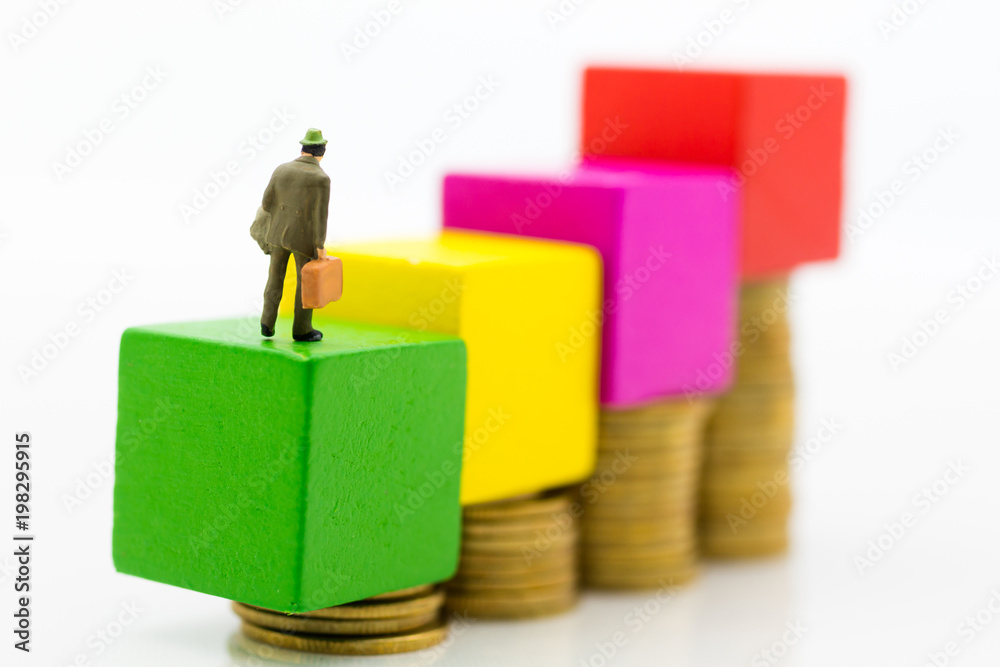 Miniature people :Graph showing performance, profits generated by the business. Image use for business concept. Miniature people :Graph showing performance, profits generated by the business. Image use for business concept.