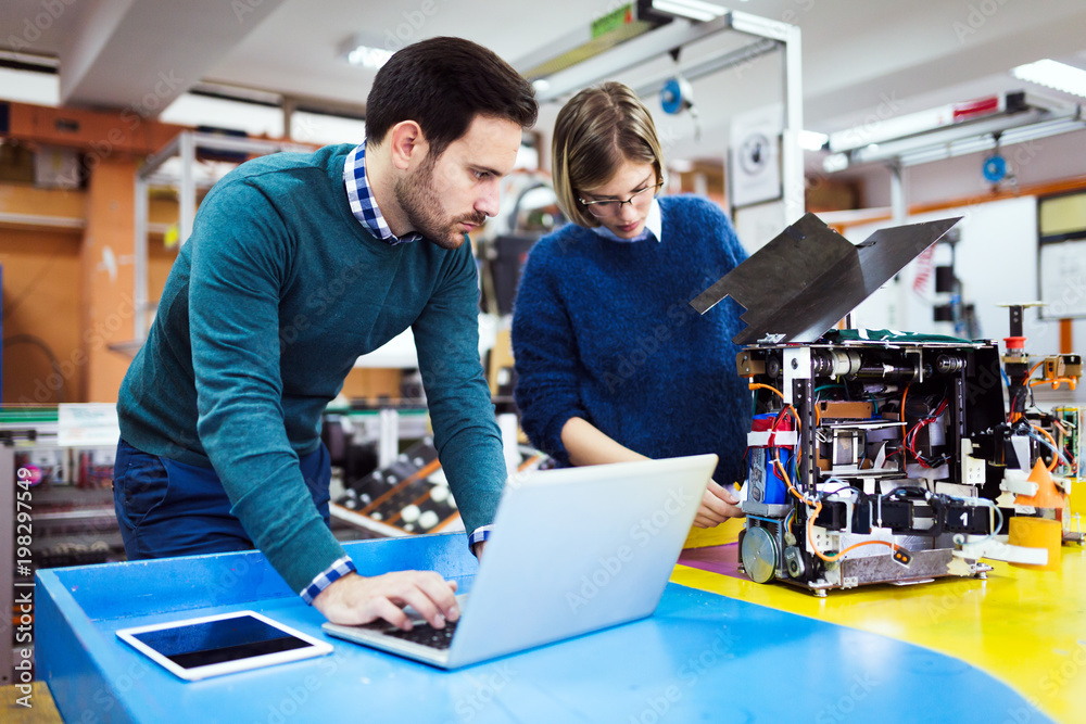 Young students of robotics working on project Young students of robotics working on project