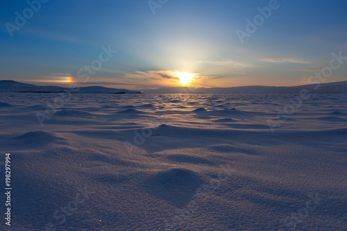 Winter landscape. Beautiful sunset in the Lake Baikal