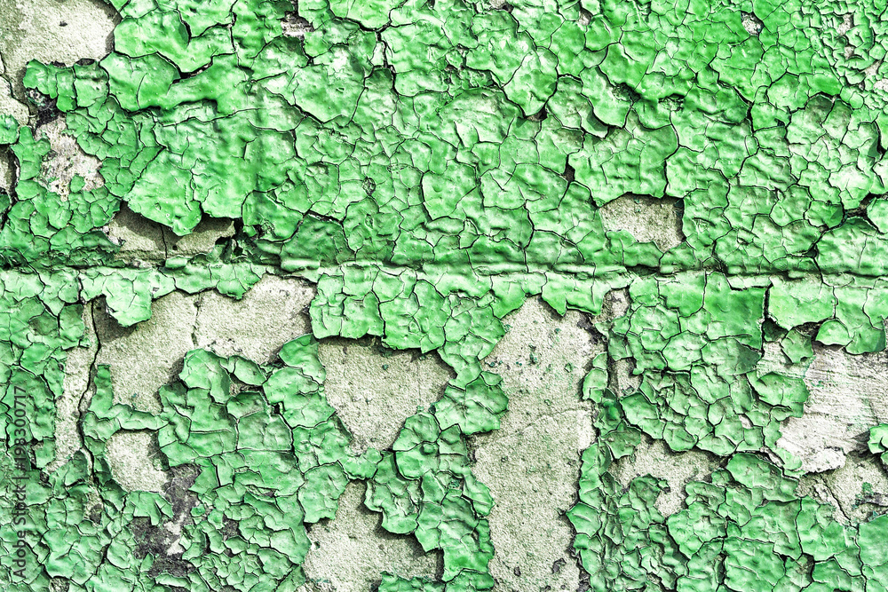 Old shabby wall texture with cracked peeling green paint Old shabby wall texture with cracked peeling green paint