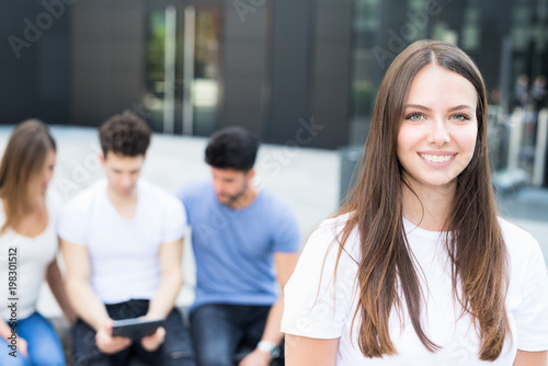 Woman in front of a group of friends Free Download Woman in front of a group of friends - GFXLoad
