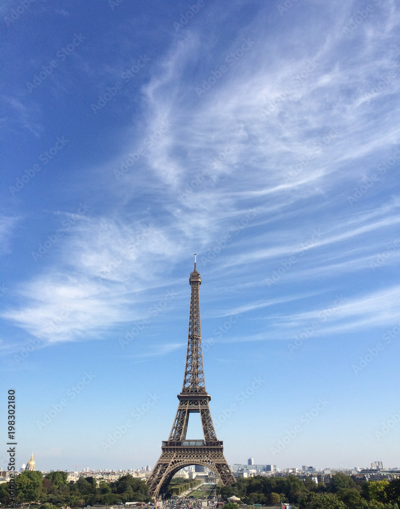 Fototapeta premium The Eiffel Tower and Blue Sky with Plenty of Spaces for Text