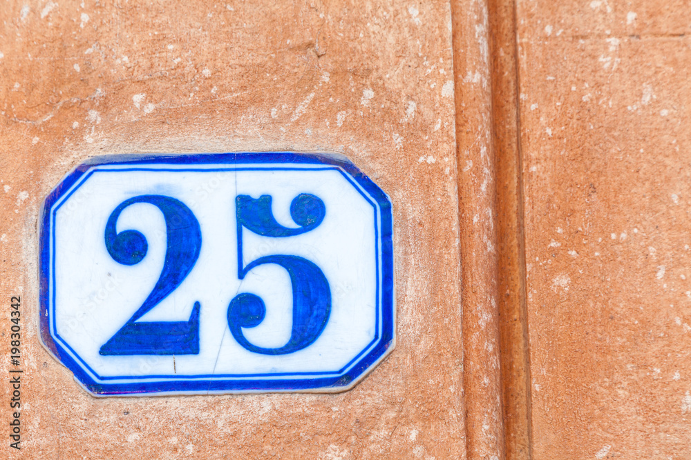 numerical tile on a stone wall background numerical tile on a stone wall background