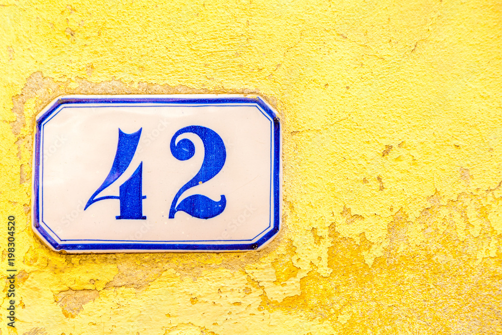 numerical tile on a stone wall background numerical tile on a stone wall background