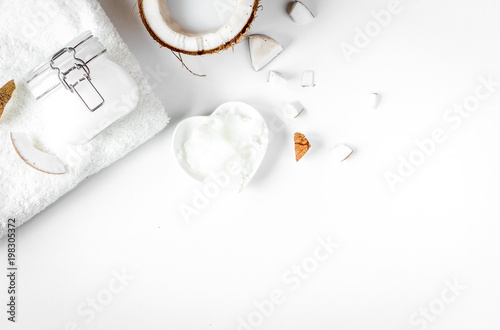 organic cosmetics with coconut on white background top view mock