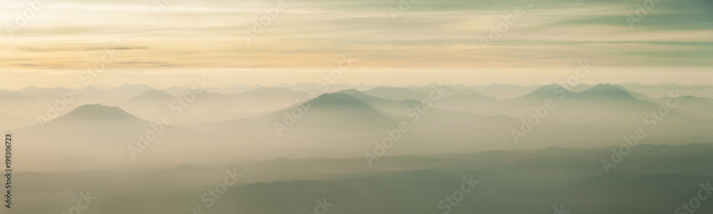 Fototapeta premium aerial airplane window view on the Eduardo Avaroa National reserve in southeast Bolivia during sunrise