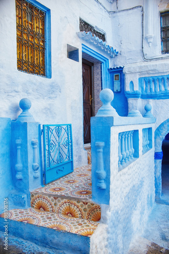 Beautiful diverse set of blue doors of the blue city of Chefchaouen in Morocco. Streets of the city are painted in blue in various shades. Fabulous blue town