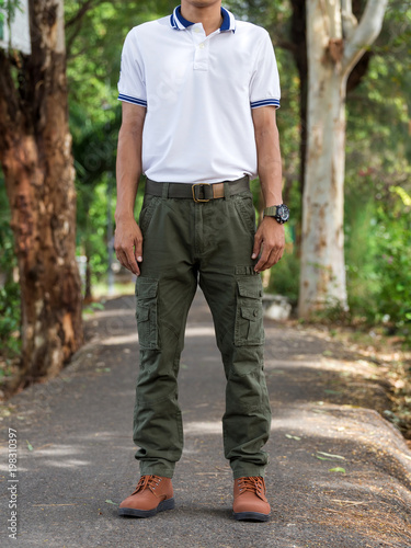 Man wearing cargo pants standing in the nature park