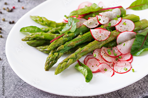 Salad from asparagus with radish and chard. Vegan cuisine. Healthy food.