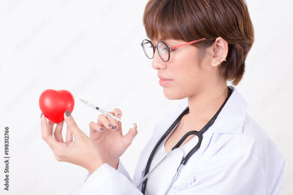 Doctor vaccination to the red heart. Isolated on white background. Studio lighting. Concept for healthy and medical Doctor vaccination to the red heart. Isolated on white background. Studio lighting. Concept for healthy and medical