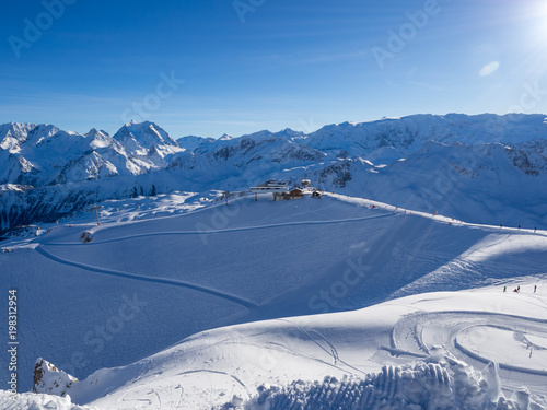 Skiing with amazing view of french famous mountains in beautiful winter snow 3 vallees France, Meribel. 2018. Blue sky and a lot of snow. photo