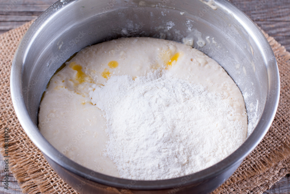 Raw dough in a bread baking dish