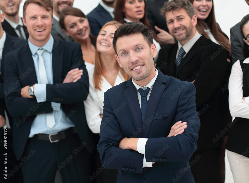 leader standing in front of a large business team leader standing in front of a large business team