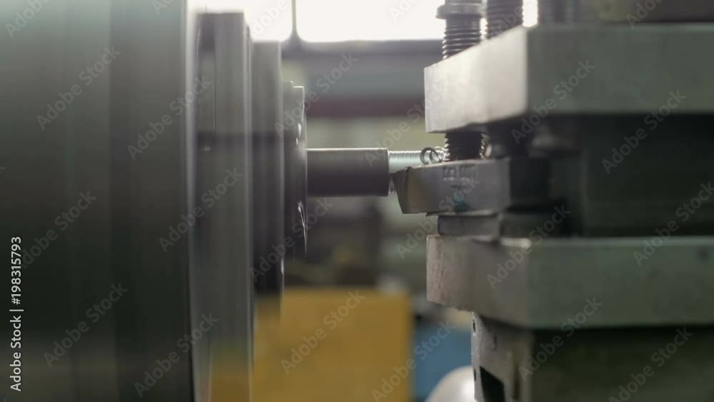 Old turning lathe machine in turning workshop. Turning machine cutting tool centar for high precision manufacturing. Close Up.
Old turning lathe machine in turning workshop. Turning machine cutting tool centar for high precision manufacturing. Close Up.