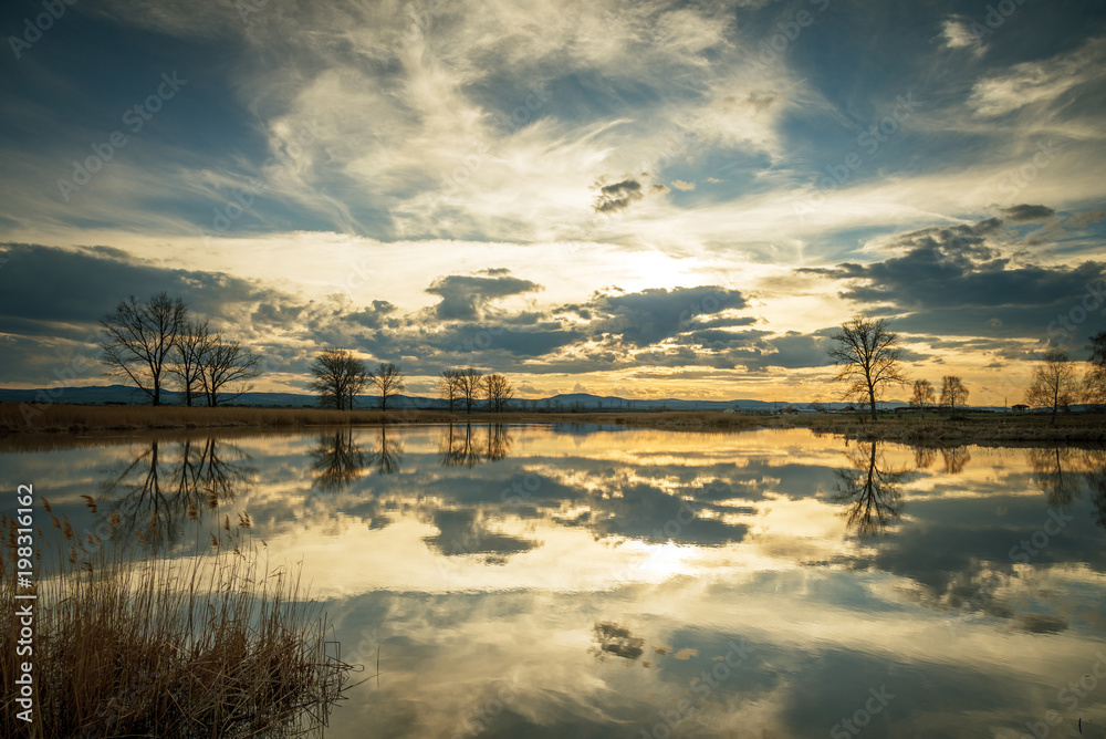 Sunset over lake and beautiful clouds. Sunset over lake and beautiful clouds.