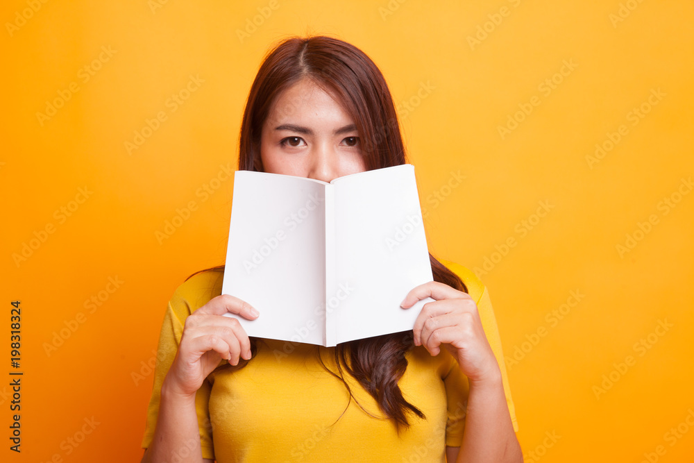 Young Asian woman with a book. Young Asian woman with a book.