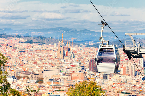 Cable car to Montjuic hill. Cityscape of Barcelona. Sagrada Familia. photo